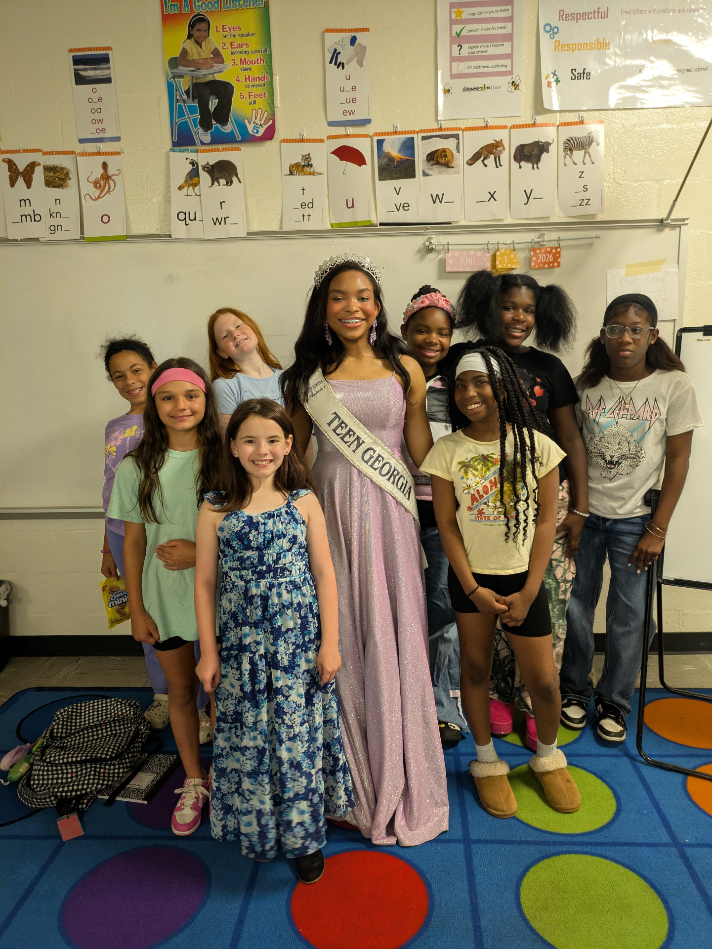 Victoria Mylan standing with a group of girls at school