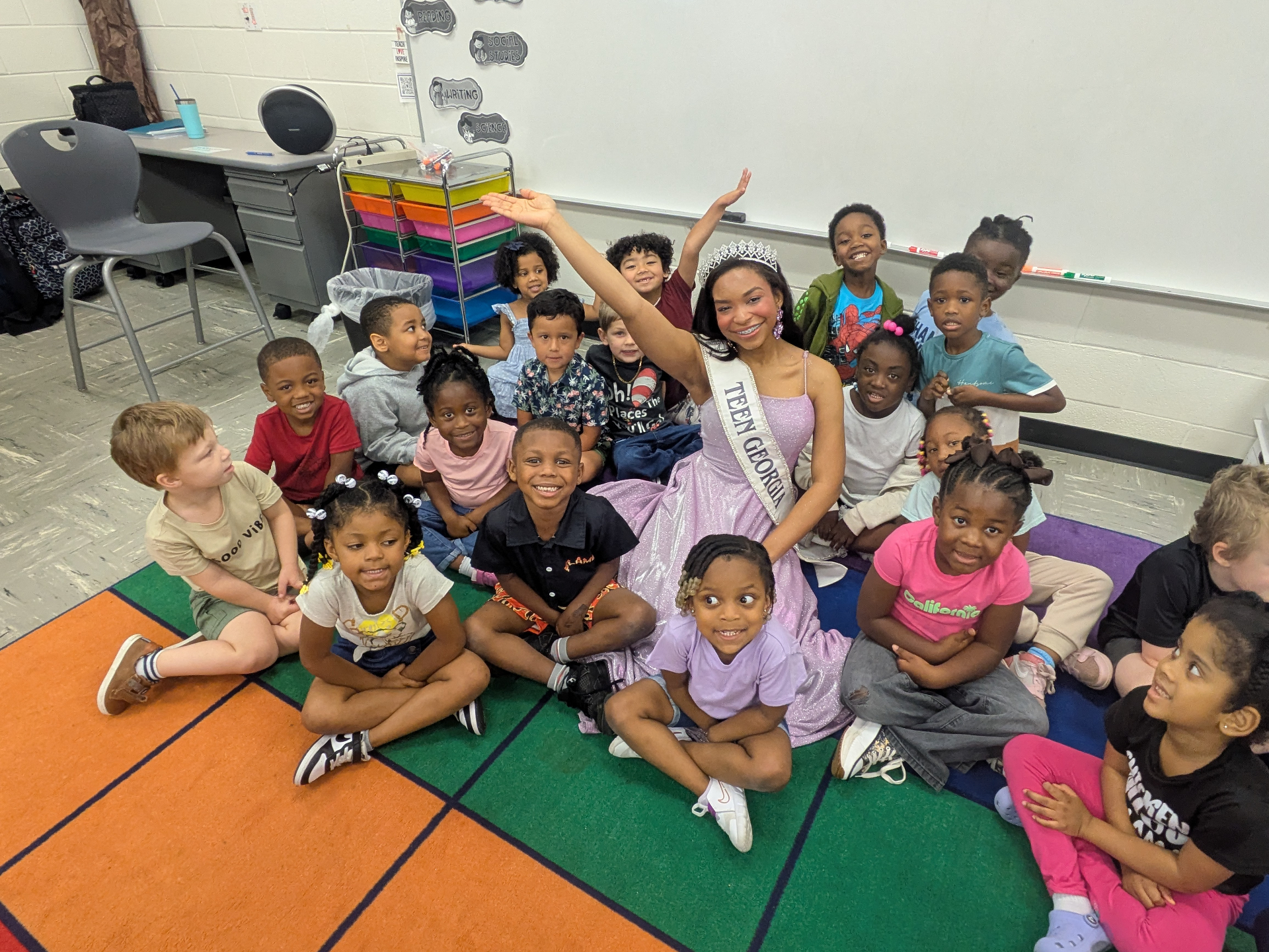 Victoria Mylan with children gathered for storytime and encouragement