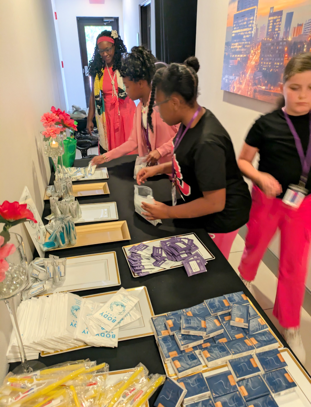Girls packing hygiene kits for the homeless at the Girl Yes You Can Conference