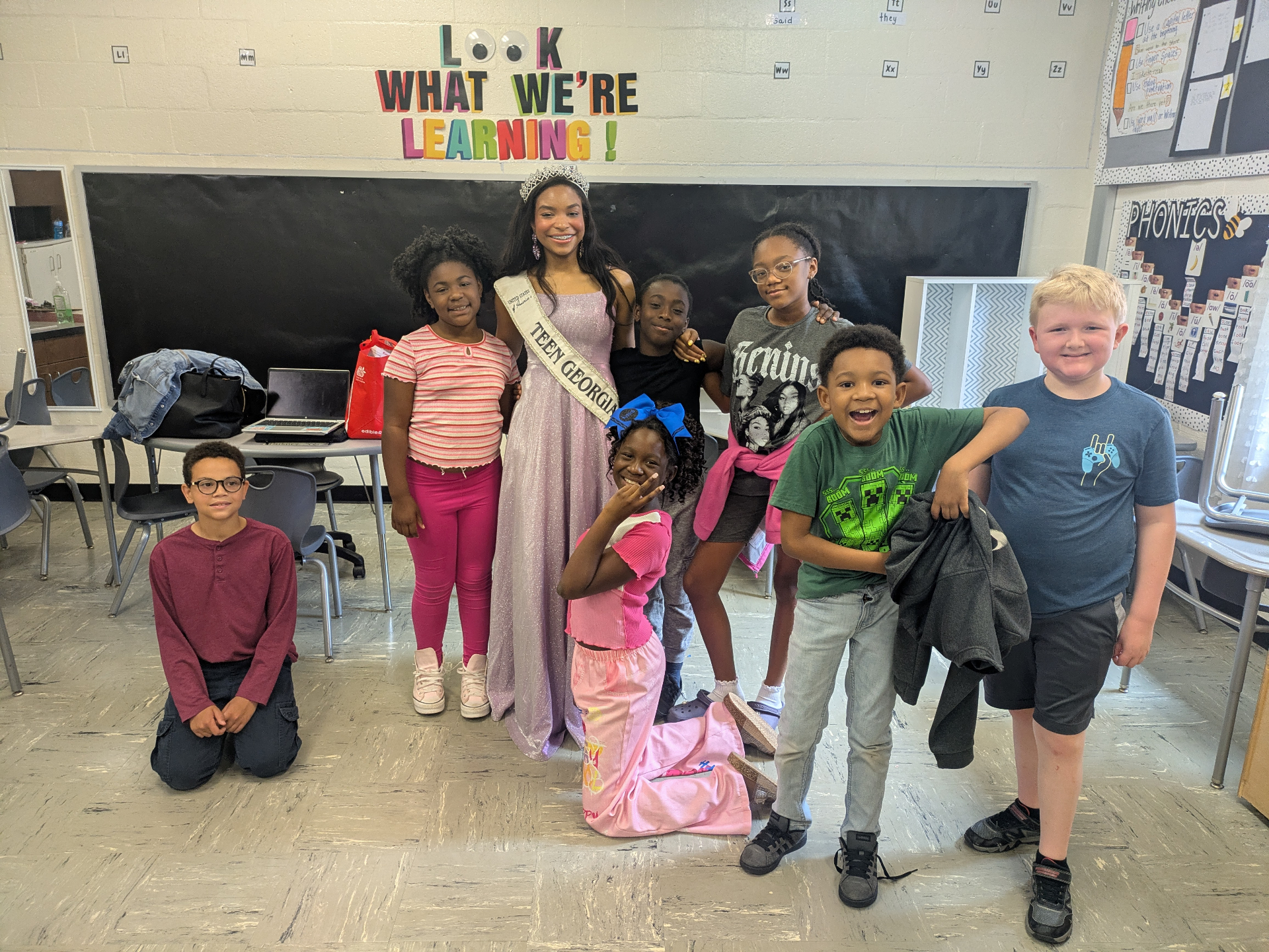 Victoria Mylan with elementary students in a classroom